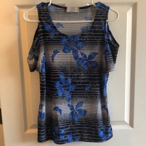 Blue/black stripped shirt with floral pattern.